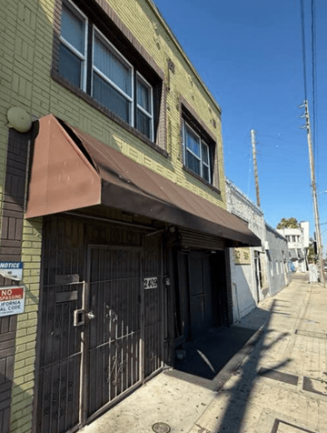 Los Angeles apartment for rent - A building with a brown awning and a sign that says "NO PARKING ANY TIME".