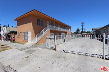 Los Angeles apartment for rent - A brown building with a metal fence in front.