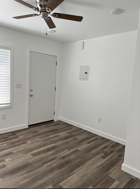 Los Angeles apartment for rent - an empty room with a ceiling fan and a door