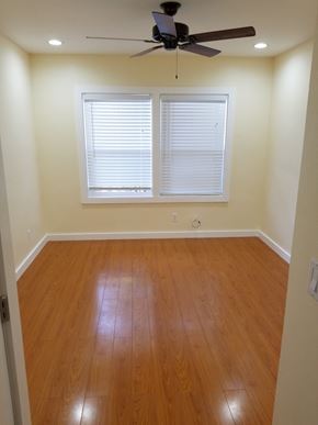 Los Angeles apartment for rent - A room with a ceiling fan and a window with blinds.