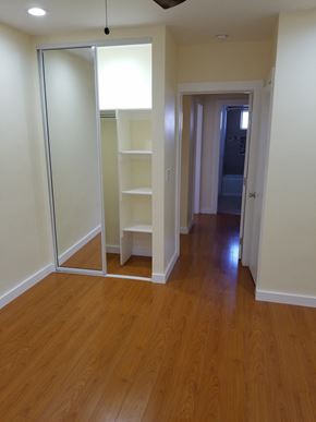 Los Angeles apartment for rent - A room with a sliding door and shelves.