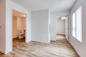San Diego apartment for rent - A room with a toilet and sink visible through an open door.