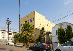 Los Angeles apartment for rent - A street view with cars and buildings.
