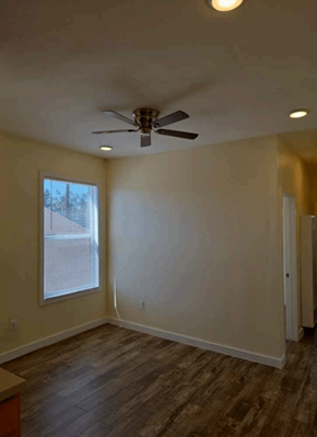 Los Angeles apartment for rent - A room with a ceiling fan and a window.