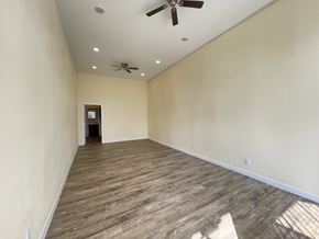 Los Angeles apartment for rent - A room with a ceiling fan and wooden flooring.