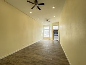 Los Angeles apartment for rent - A room with a ceiling fan and wooden flooring.