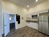 Los Angeles apartment for rent - A kitchen with a refrigerator, microwave, and oven.