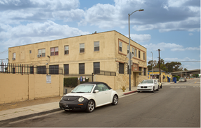 Los Angeles apartment for rent - A white car is parked on the side of a street.