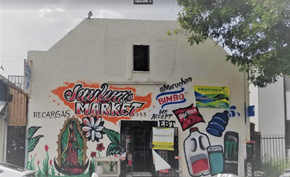 Los Angeles apartment for rent - A wall with a mural of a woman surrounded by flowers and a sign that says "Sanchez's Market".