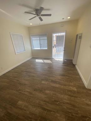 Los Angeles apartment for rent - A room with a ceiling fan and wooden flooring.
