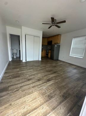 Los Angeles apartment for rent - A room with a ceiling fan and wooden flooring.
