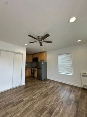 Los Angeles apartment for rent - A room with a ceiling fan and wooden flooring.
