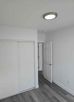 Los Angeles apartment for rent - A white door is open to a hallway.