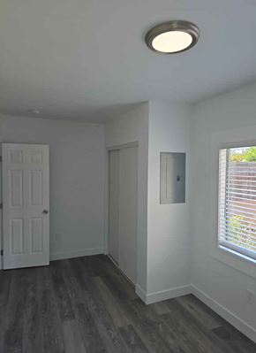 Los Angeles apartment for rent - A room with a white door and a window with blinds.