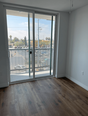 Los Angeles apartment for rent - A room with a sliding glass door leading to a parking lot.