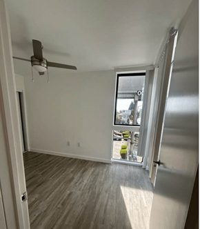 Los Angeles apartment for rent - A room with a ceiling fan and a sliding glass door.
