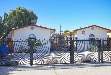 Los Angeles apartment for rent - A white building with a black gate in front.