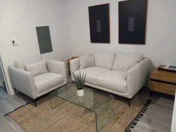 Los Angeles apartment for rent - A living room with two couches and a glass coffee table.