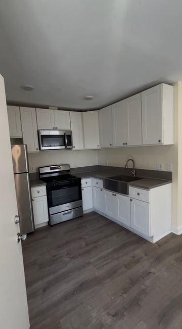 Los Angeles apartment for rent - A kitchen with white cabinets and stainless steel appliances.