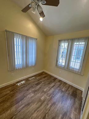 Los Angeles apartment for rent - A room with a ceiling fan and wooden flooring.