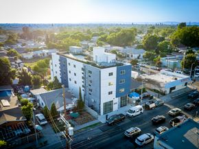 Los Angeles apartment for rent - an aerial view of a large white building in a city