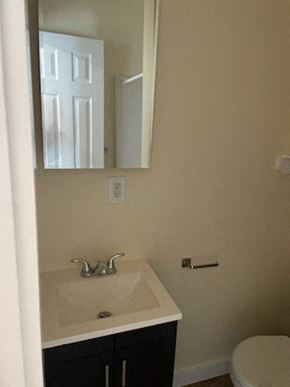 Los Angeles apartment for rent - A bathroom with a sink, mirror, and toilet.
