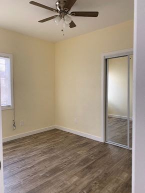 Los Angeles apartment for rent - A room with a ceiling fan and wooden flooring.
