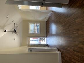 Los Angeles apartment for rent - a view of a living room with a window and a ceiling fan