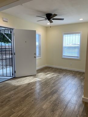 Los Angeles apartment for rent - A room with a ceiling fan and a white door.