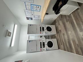Los Angeles apartment for rent - A laundry room with a washer and dryer stacked on top of each other.