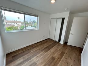 Los Angeles apartment for rent - A room with a window overlooking a residential area.