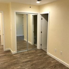 Los Angeles apartment for rent - A room with a sliding door and a mirror.