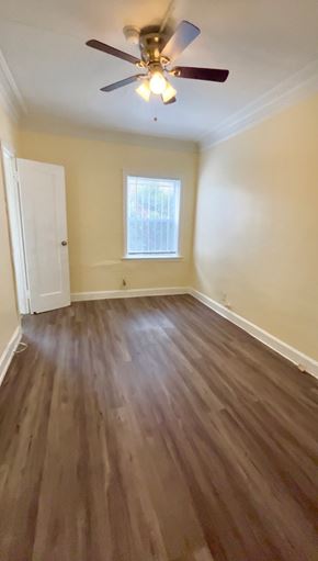 Los Angeles apartment for rent - A room with a ceiling fan and wooden flooring.