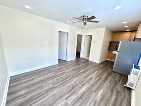 Los Angeles apartment for rent - A room with a ceiling fan and wood flooring.