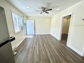Los Angeles apartment for rent - A room with a ceiling fan and wooden flooring.