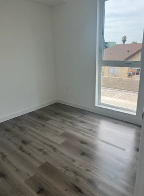 Los Angeles apartment for rent - an empty room with a large window and wooden floors