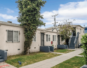 Los Angeles apartment for rent - A row of houses with a tree in front of the first one.