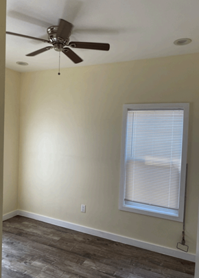 Los Angeles apartment for rent - a living room with a ceiling fan and a window