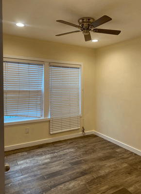 Los Angeles apartment for rent - a living room with a window and a ceiling fan