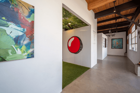 Los Angeles apartment for rent - a hallway with paintings and a baseball ball on the wall