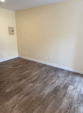 Los Angeles apartment for rent - A room with wooden flooring and a white wall.