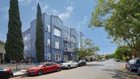 Los Angeles apartment for rent - A red car is parked on the side of a street.