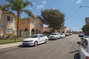 Long Beach apartment for rent - A white car is parked on the side of a street.