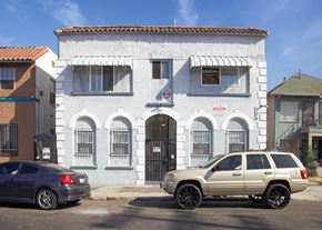 Los Angeles apartment for rent - A white building with a black gate in front.