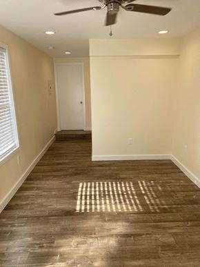 Los Angeles apartment for rent - A room with a ceiling fan and wooden flooring.