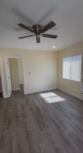 Los Angeles apartment for rent - A room with a ceiling fan and a window with blinds.