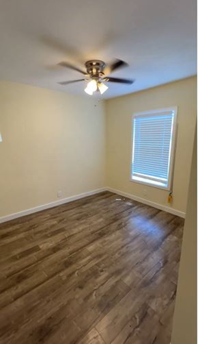 Los Angeles apartment for rent - A room with a ceiling fan and wooden flooring.