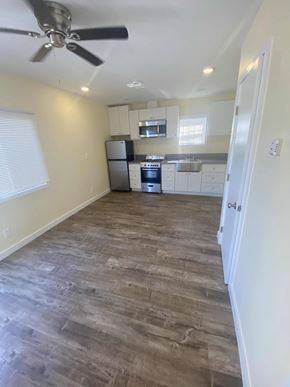 Los Angeles apartment for rent - A kitchen with a fan on the ceiling and wooden flooring.