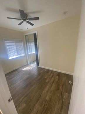 Los Angeles apartment for rent - A room with a ceiling fan and wooden flooring.