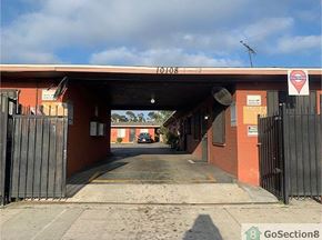Los Angeles apartment for rent - A red building with a black gate in front of it.